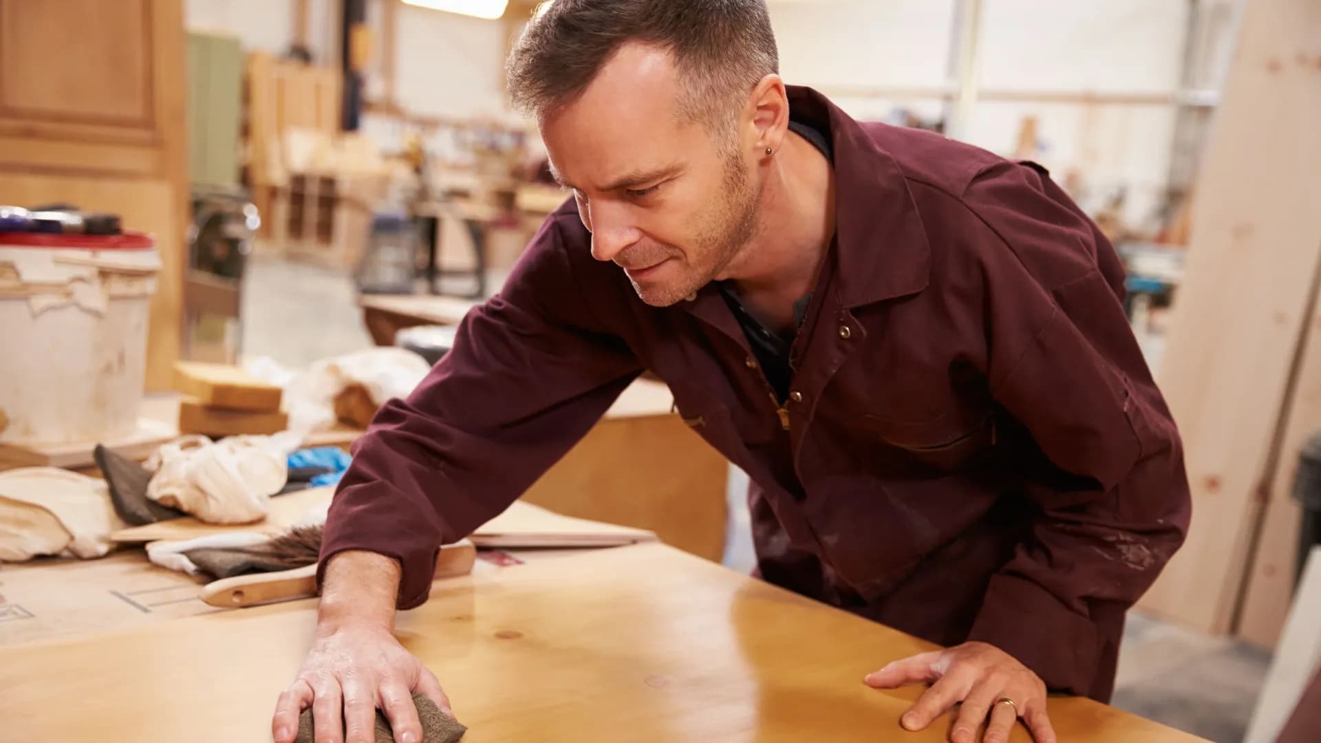 Cowboy Custom Cabinets professional checking the custom finish provided to local Idaho client.